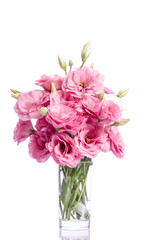 bunch of white and pink eustoma flowers in glass vase isolated on white
