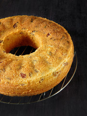Close-up of a basic sponge cake. A cake is prepared to be decorated on a dark background
