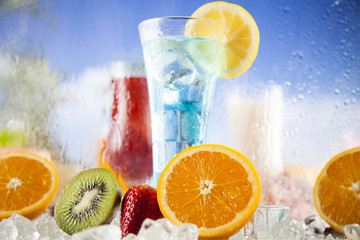 Fresh tropical fruits, Summer drink and palm branch