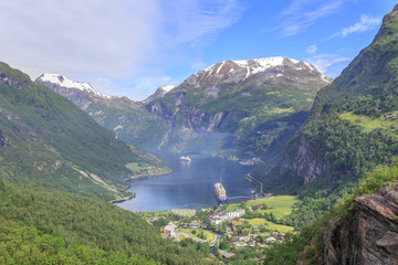 Fototapeta na wymiar View of Geiranger fjord and Geiranger village and Eagle Road. It is a 15 km long branch of Sunnylvsfjorden, which is a branch of Storfjorden, it was listed as a UNESCO World Heritage Site 