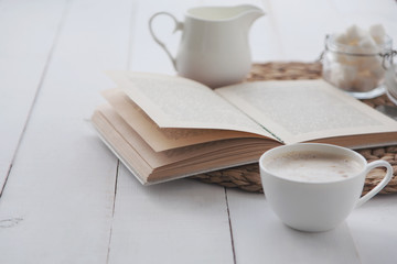 Morning coffee and reading a book