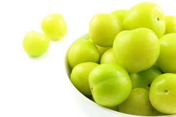 fresh turkish can erik plum fruits in a small white bowl