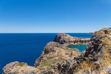 Bay and shore of the city of lindos. Blue water and wonderful beaches of Rhodes island.