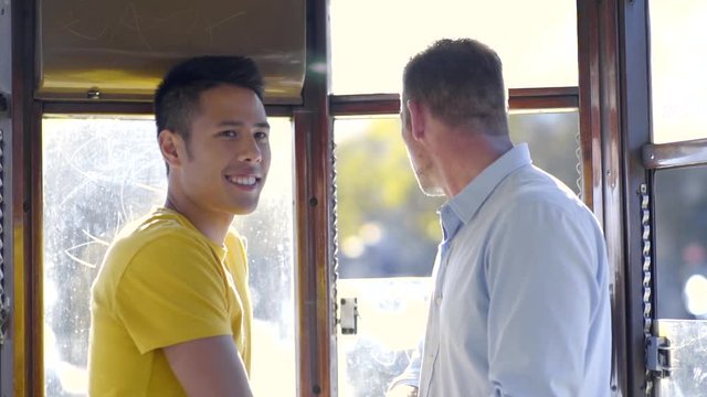 Gay Couple Enjoy Sightseeing By Street Car, In San Francisco