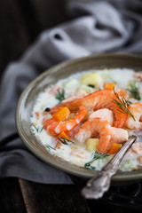 Hot salmon and shrimps cream soup