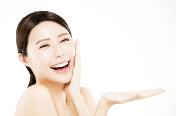 happy Beauty woman showing  beauty product on her hand 