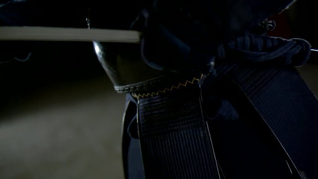 Kendo warrior demonstrates fighting attacks in slow motion