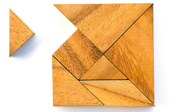 Wooden tangram puzzle in square shape wait for fulfill on white background