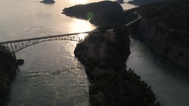 Amazing Lighting in Aerial of Bridge Crossing Ocean Islands in Pacific Northwest