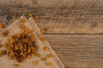 Raisins  on the old wooden table.