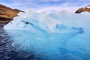 iceberg floating in greenland fjord
