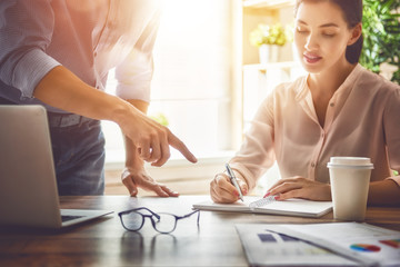 man and woman working in the office