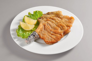 Plate with breaded cutlet Milanese