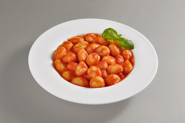 Plate with portion of tomato dumplings