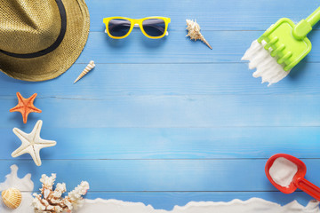 Beach toys on blue plank, holiday summer