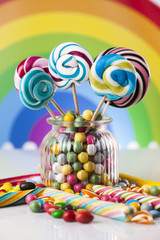 Glass jars in Colorful candies,lollipops and gum balls