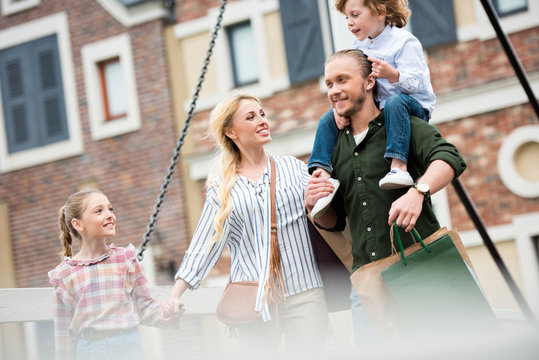 Portrait Of Big Happy Family Walking On Street After Shopping At Street