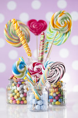Glass jars in Colorful candies,lollipops and gum balls
