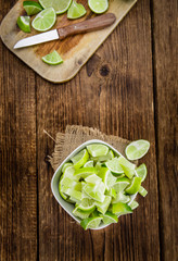 Wooden table with Lime Slices (selective focus)