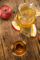 Apple Cider (selective focus) on vintage wooden background