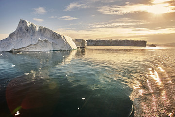 iceberg floating in greenland fjord © the_lightwriter