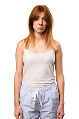 Obraz premium Sad beautiful girl in pajamas