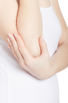 Woman holding elbow in pain isolated on white, clipping path