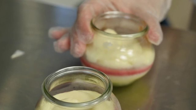 Sweet cream in a mason jar. Churning of Sweet cream in a glass jar