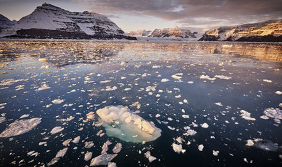 iceberg floating in greenland fjord
