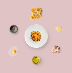 Cooking ingredients for italian food, carbonara, isolated on yellow background