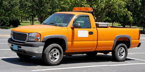 Orange department of transportation utility pickup truck. - obrazy, fototapety, plakaty