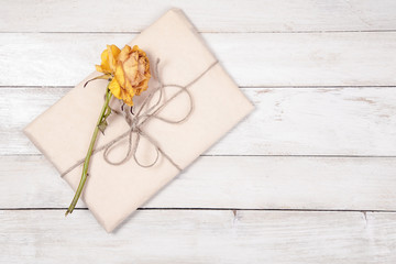 Paper wrapped package with dry rose