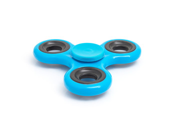Blue spinner stress relieving toy isolated on white background