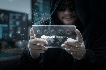 Hacker using clear tablet with HUD panel and code graph bar data analytsis element for cyber technology concept