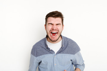 Portrait of angry crying man, isolated