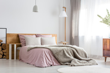Grey blanket on bed - obrazy, fototapety, plakaty