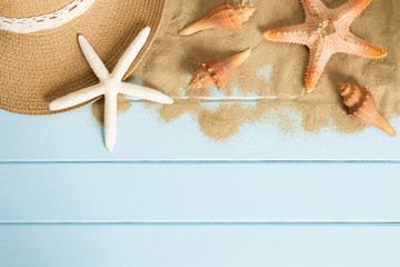 Sand and shells on the wooden floor of the blue,summer concept