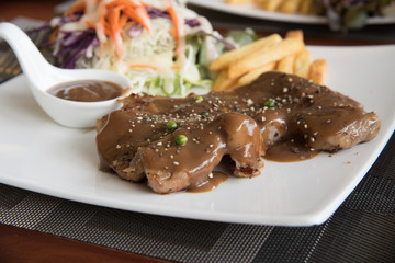 Steak and gravy on plate
