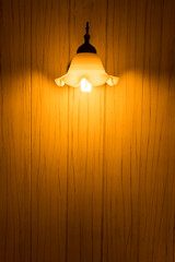 yellow bulb light with wall wood