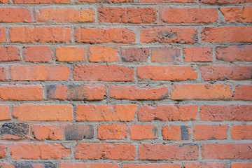 Vintage red painted old brick with cracks and scratches for natural design, patterns