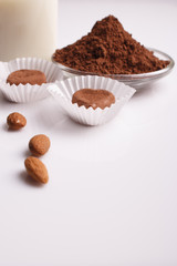 Chocolate heart-shaped candy on a white background, chocolate composition