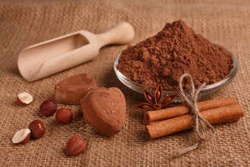 Chocolate heart-shaped candy on a rustic background, chocolate composition