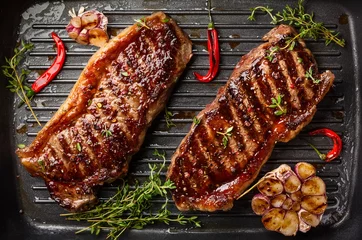 Wall murals Steakhouse Grilled  strip steak with spices