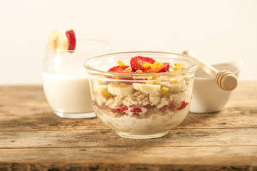 oatmeal porridge with strawberry and banana in a bowl