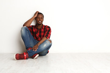 Happy smiling black man in casual at studio background