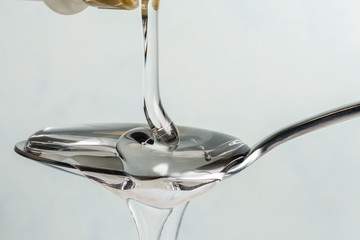 Pouring Light Corn Syrup on a Spoon