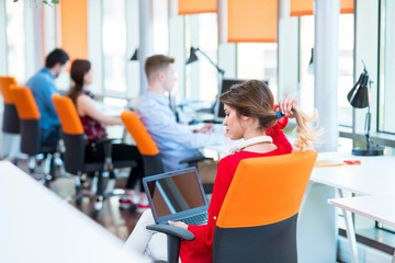 startup business, young creative people group brainstorming on meeting at office interior and using laptop and tablet computer to note ideas plans and projects