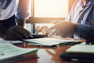 Administrator business man financial inspector and secretary making report, calculating or checking balance.