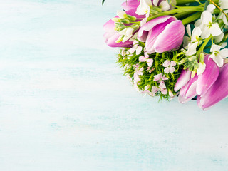 Fototapeta na wymiar Empty purple card flowers tulips roses spring pastel color background. Easter holiday, wedding birthday invitation