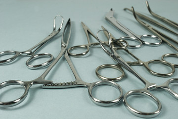 Medical surgical Instruments on blue background. Selective focus